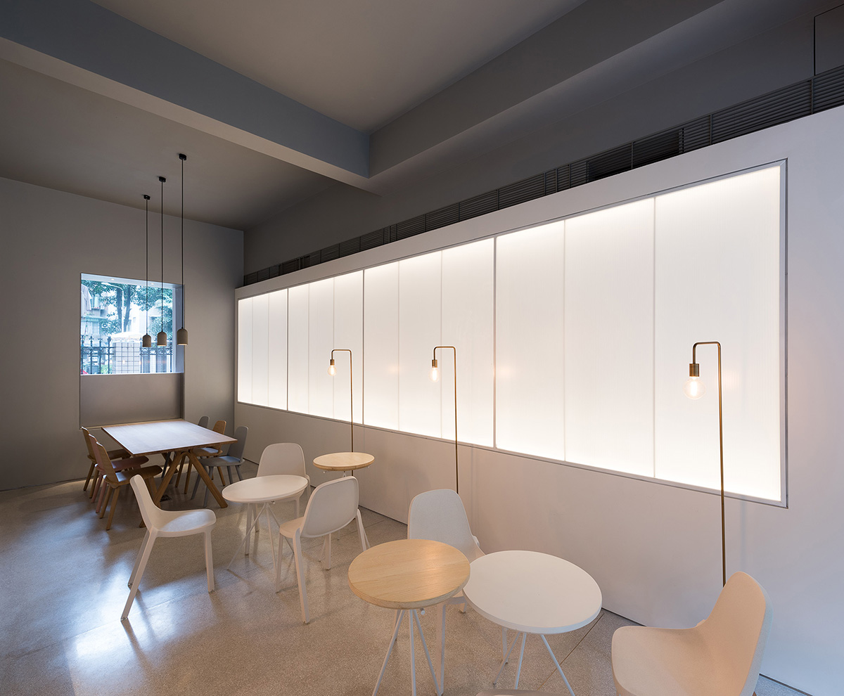 Lukstudio plays with cut-out volumes to transform old Chinese building into cafe and office