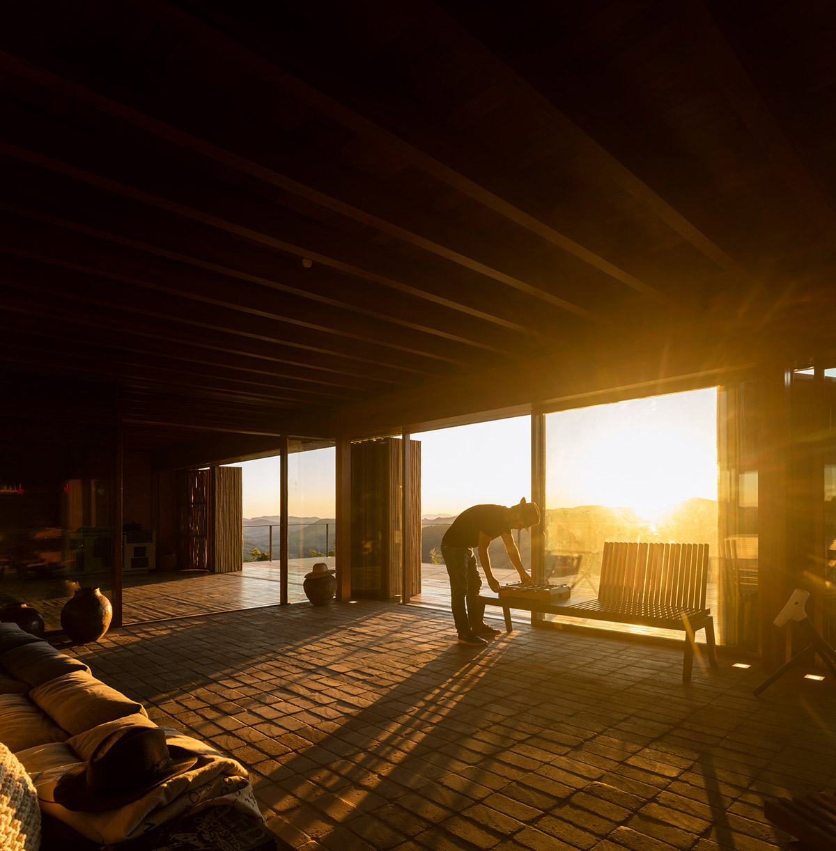 Narrow wooden Catu&ccedil;aba House by Studio MK27 produces its own energy on a valley of S&atilde;o Paulo