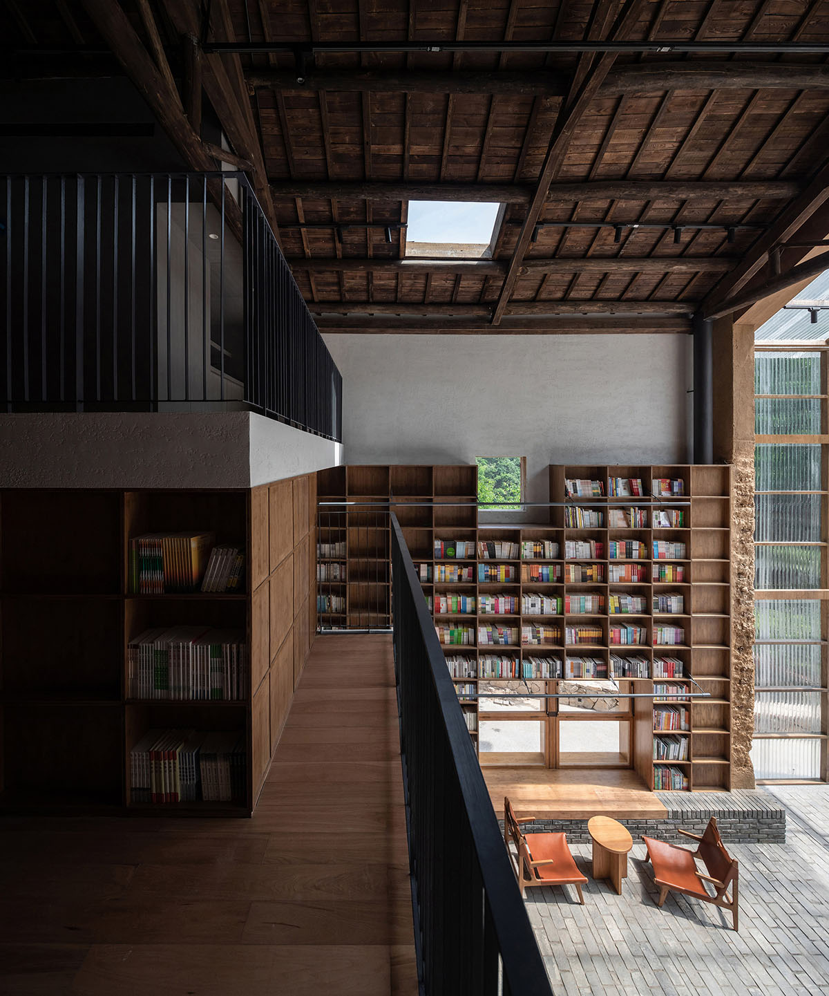 Atelier tao+c converts old building into capsule hotel with corrugated polycarbonate panels in China