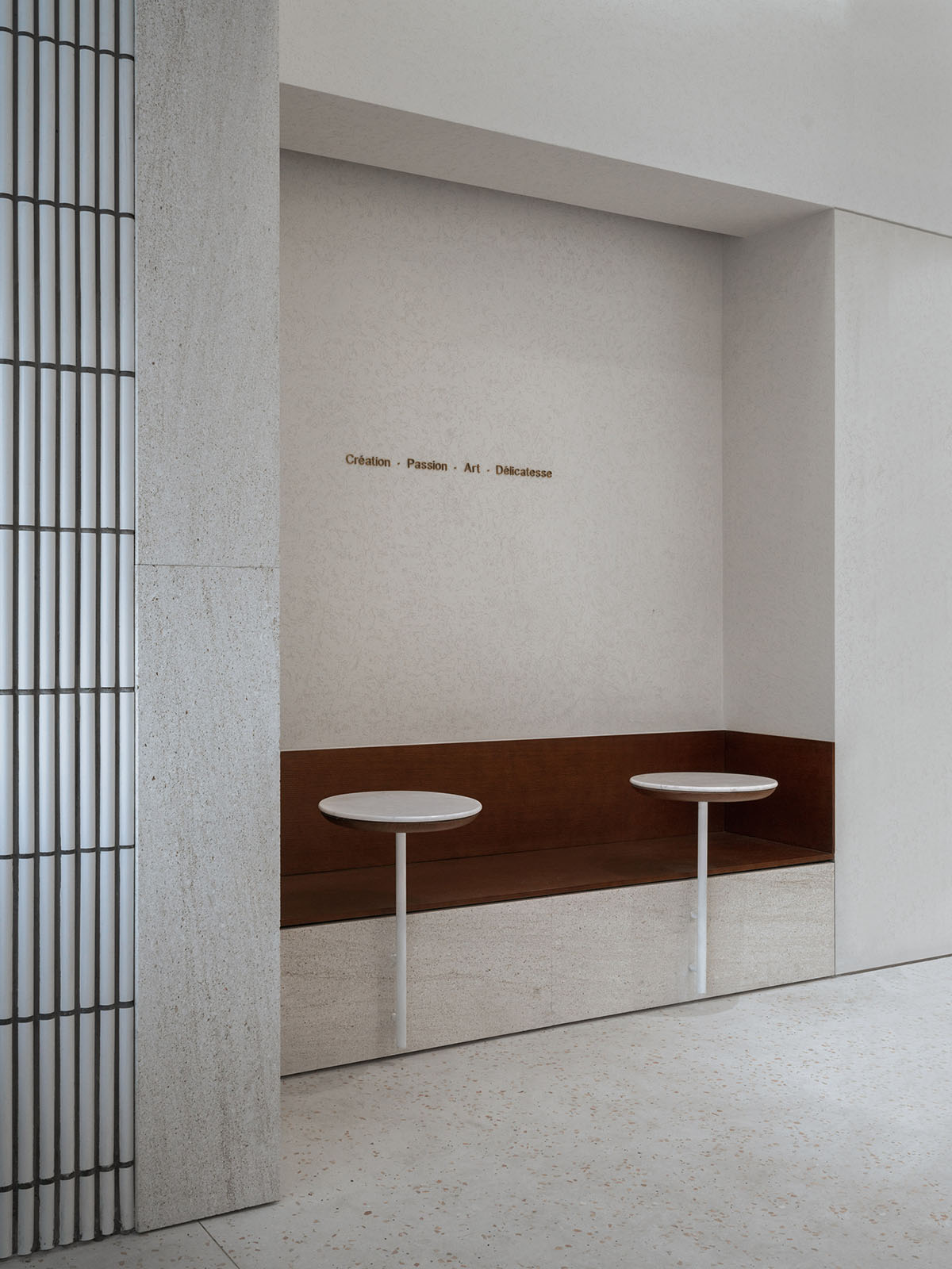 say architects uses curved tiled walls to merge exterior and interior for a patisserie in Hangzhou