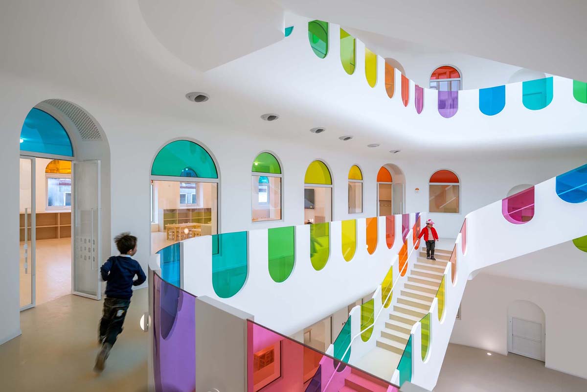 SAKO Architects designs colorful glass doors to evoke children's creativity in this school in China