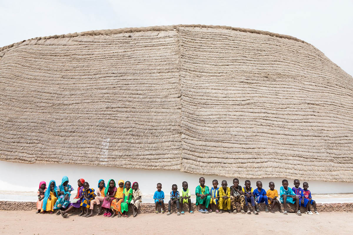 Toshiko Mori built Fass School and Teachers’ Residence featuring wavy thatched roof in remote Senegal