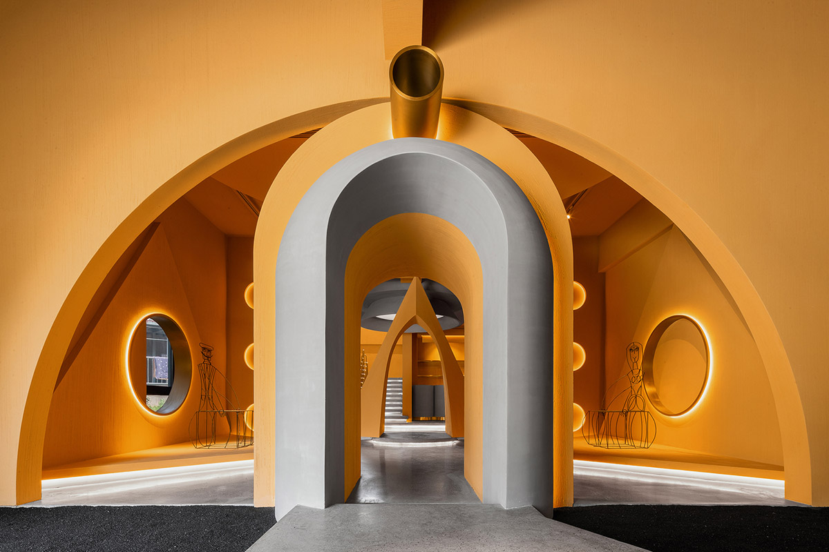 Angular corrugated stainless steel sheets form this showroom designed by PIG DESIGN in Hangzhou