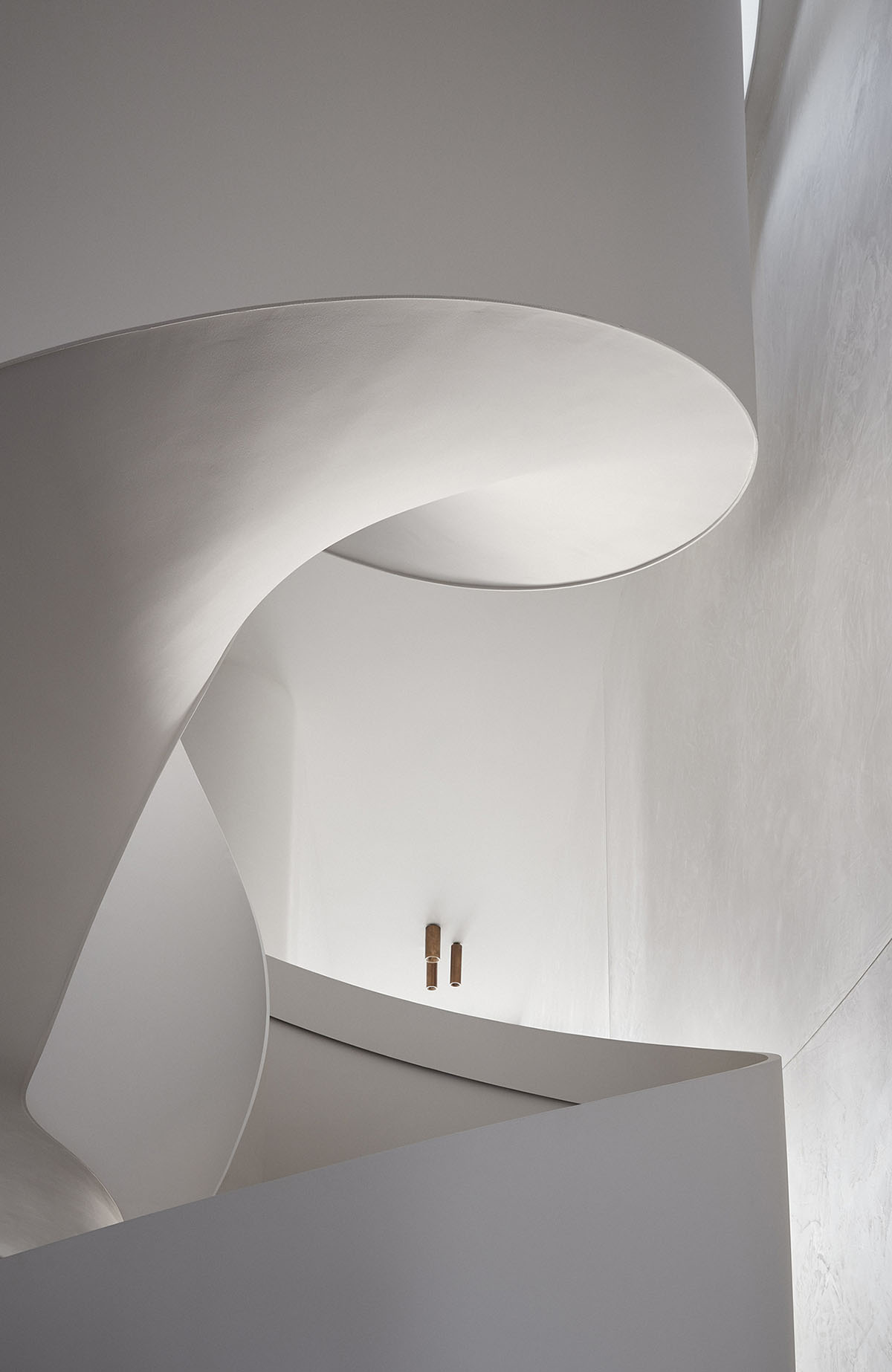 Jolson Architecture and Interiors creates fluid surfaces for interiors of this Melbourne home