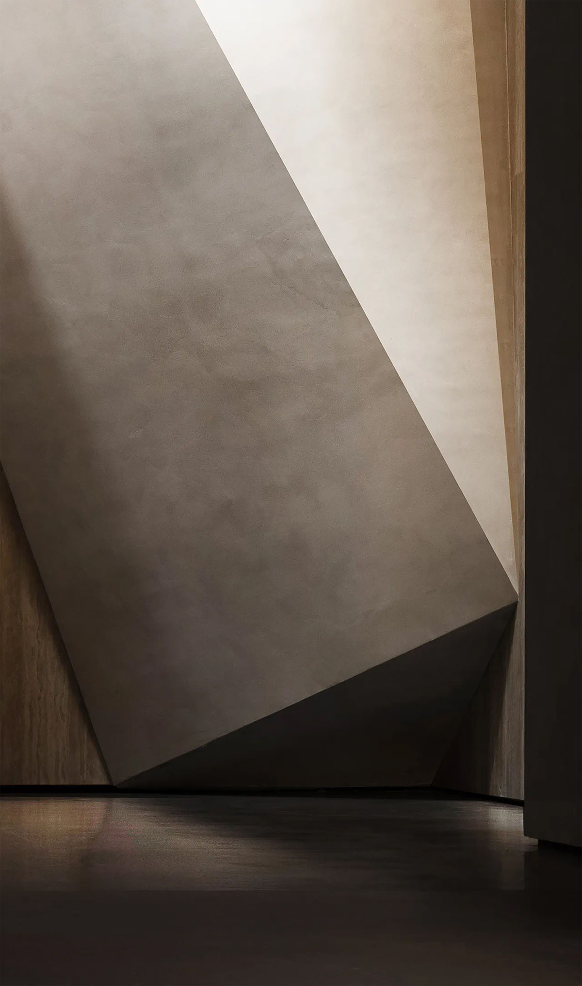 Exhibition hall interiors feature sharp angles and surfaces addressing diamond cutting processes