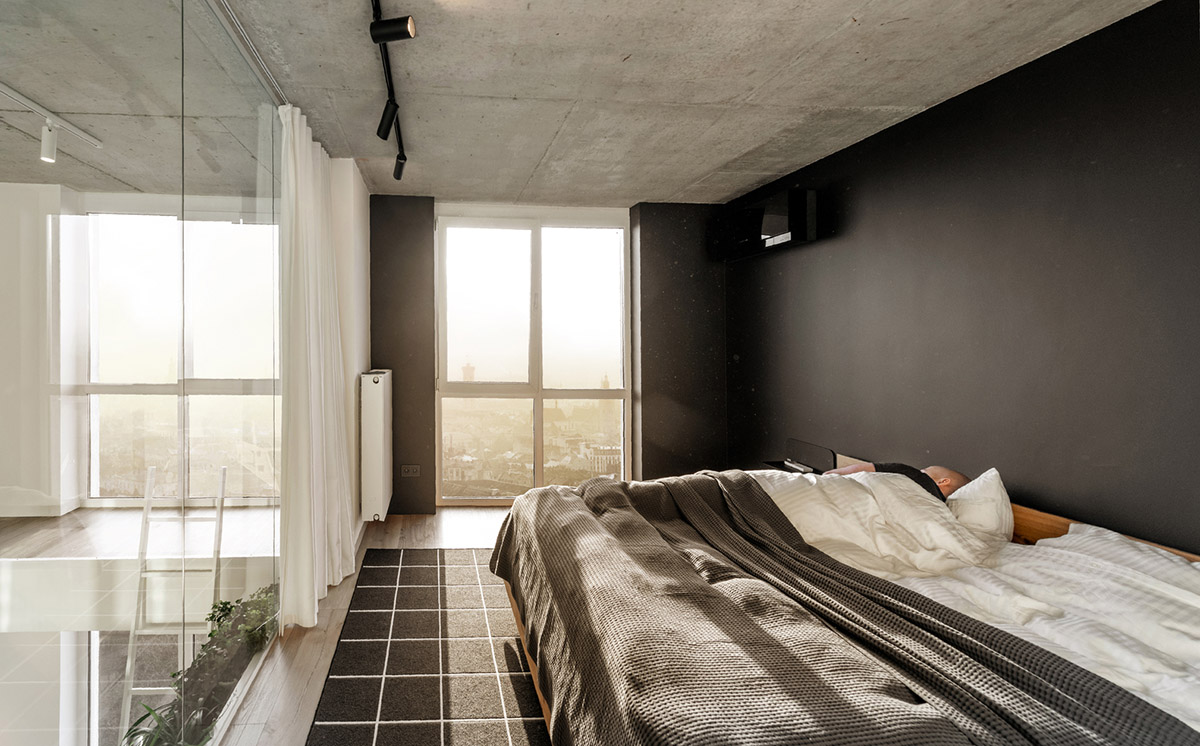 Metal framed-table, glass partitions, green infills make this interior space vivid and light in Lviv