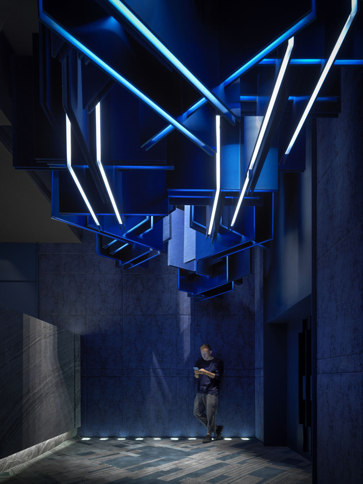 One Plus Partnership enhances depth of interior space with blue metal bars for a Cinema in Shenzhen