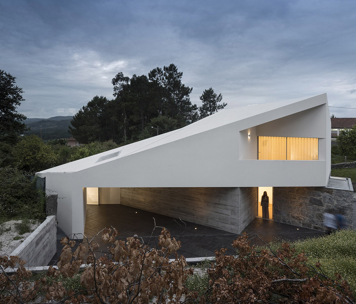 Rui Vieira Oliveira Built Multifaceted House placed atop Ancient Grape Mill In Portugal's village
