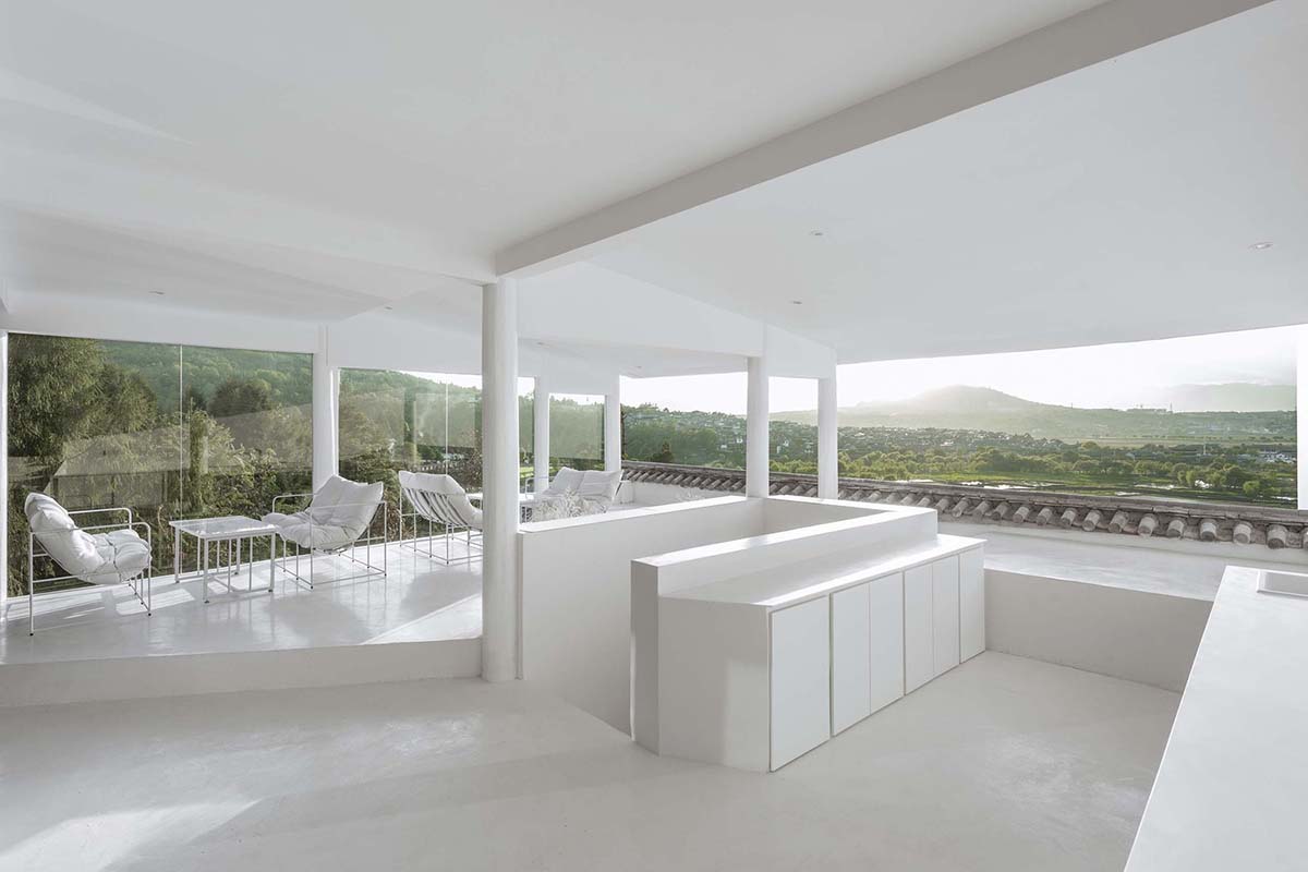 STUDIO QI reinterprets sequence of living conditions with tilted hotel on a hilly plot in China