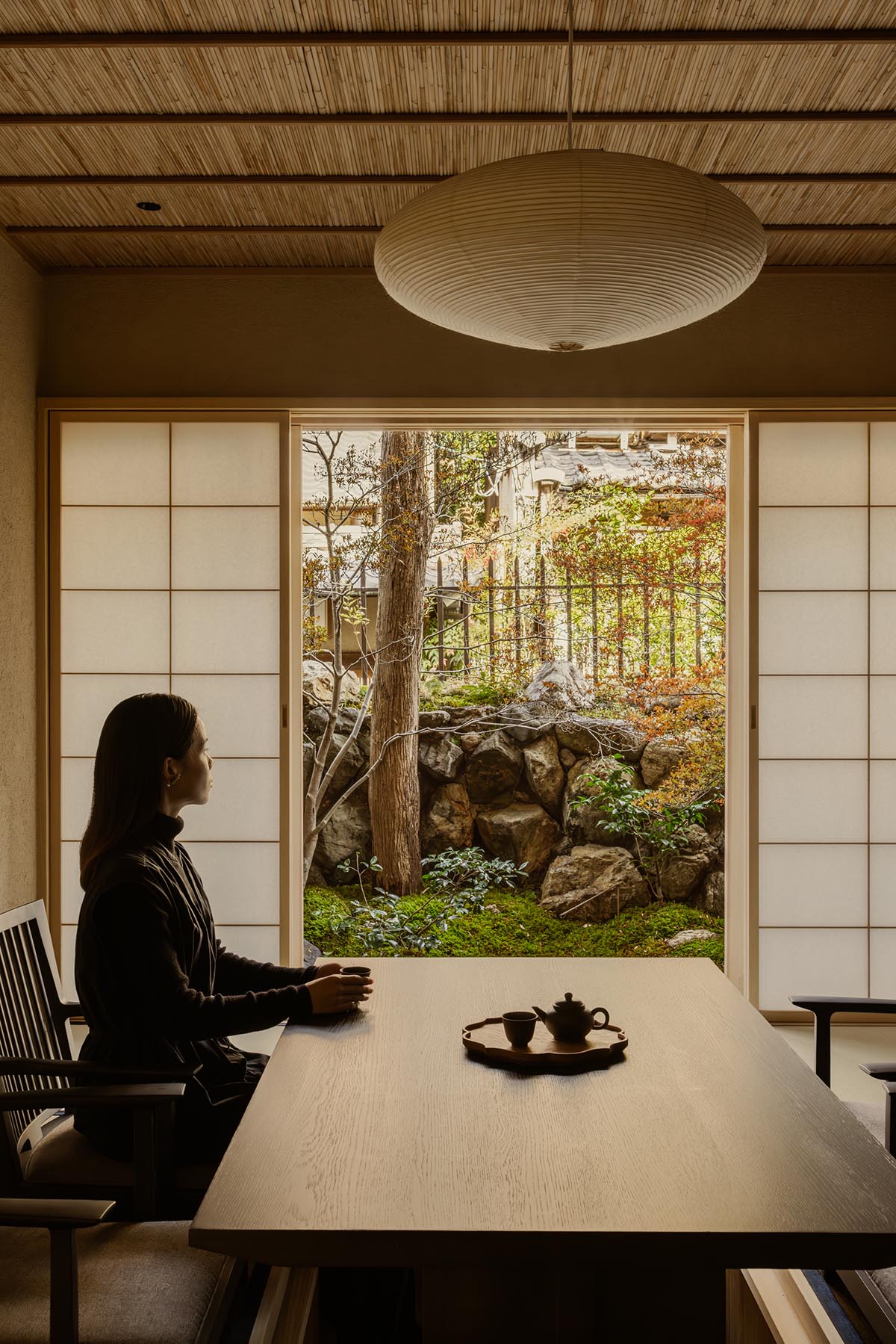 kooo architects creates a wooden interior sanctuary for contemporary accommodation in Kyoto City