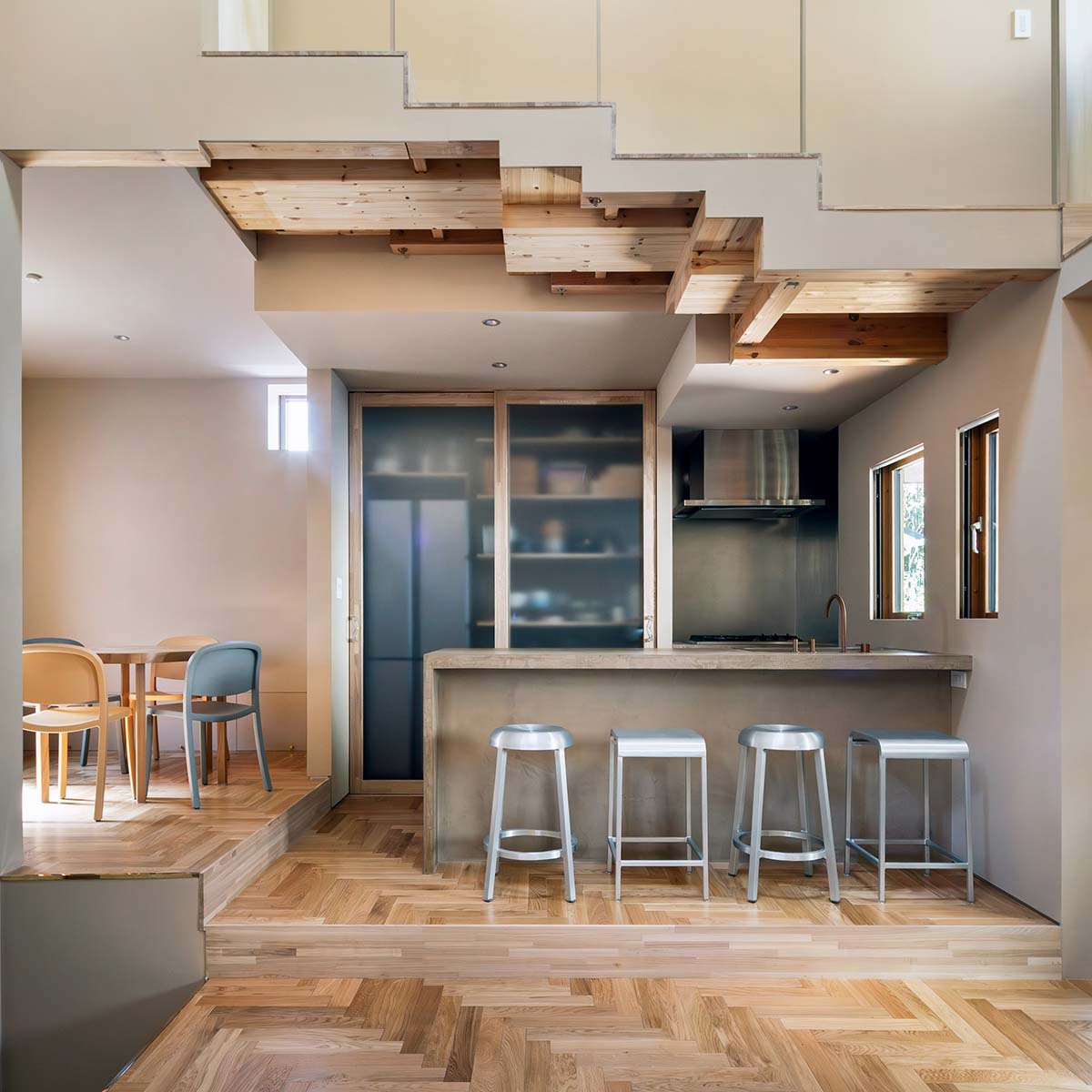 Tan Yamanouchi turns a book vault wall in studio and residence into a cozy space for cats in Japan