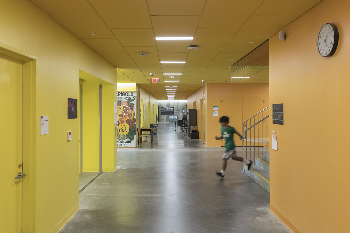 Five rectangular volumes rotating around a fixed pivot point form BIG-designed educational building