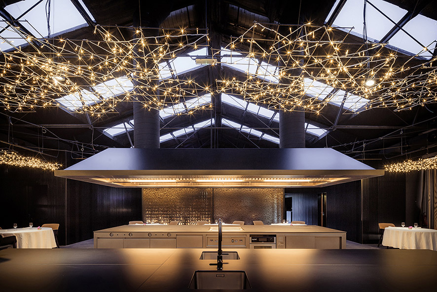 OAB transforms an old industrial warehouse into a kitchen and restaurant in Barcelona