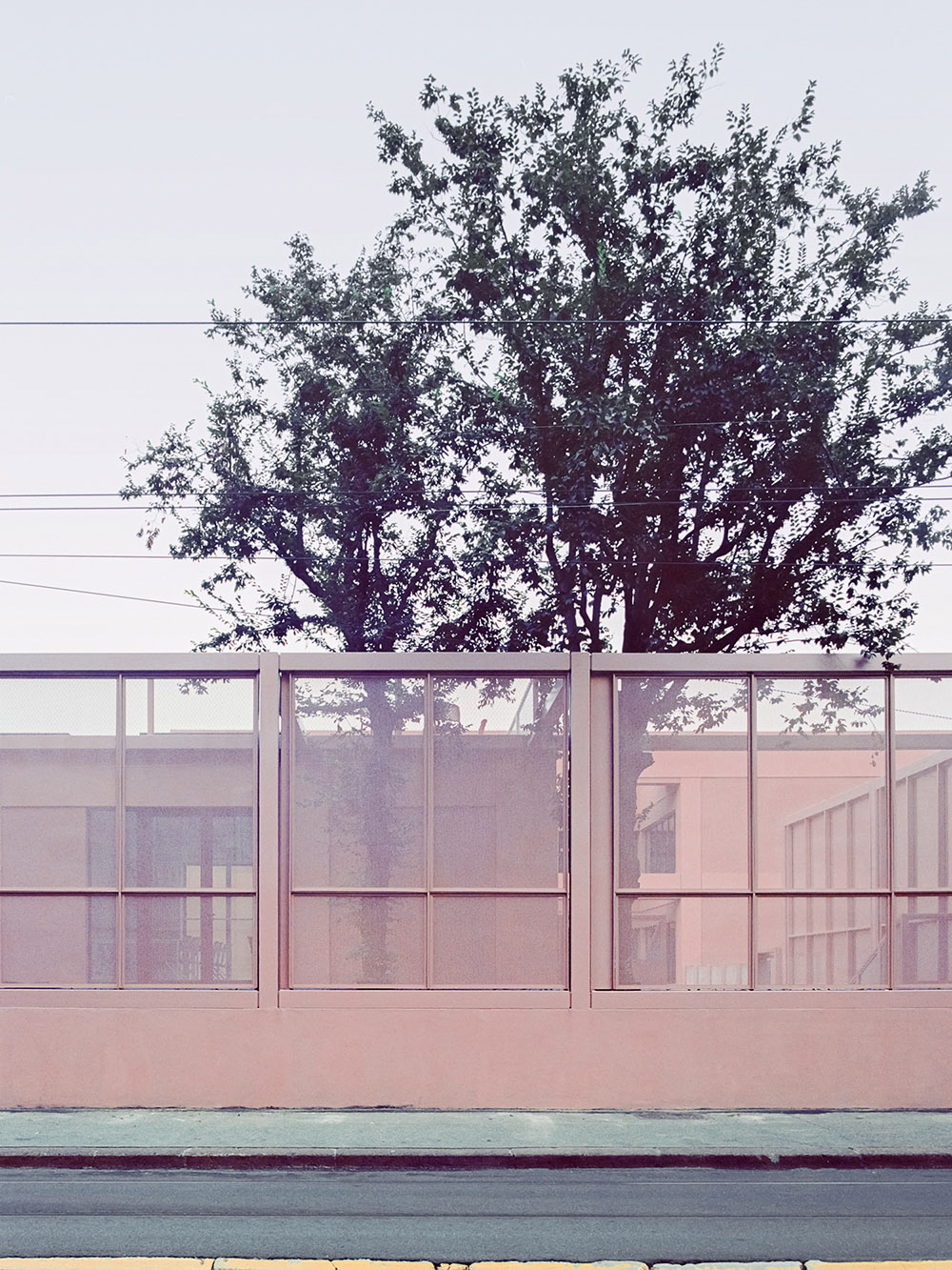 BDR bureau completes community school with pinkish steel framework in Turin