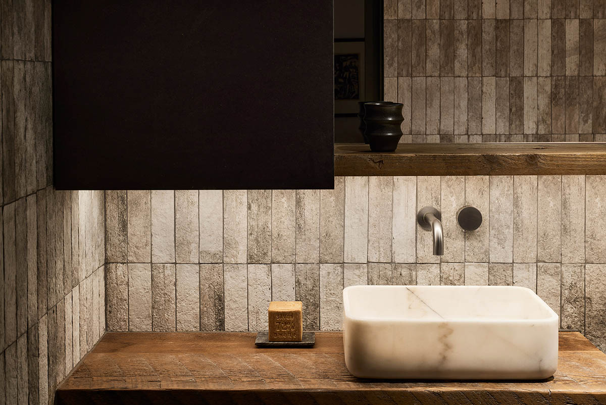 Splinter Society transforms former chocolate factory warehouse flat with earthy and rustic tones