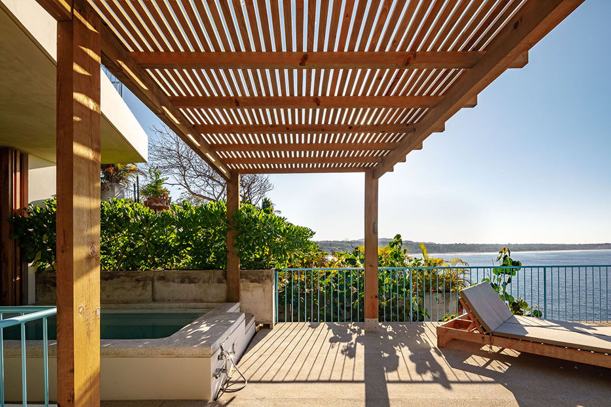 Francisco Pardo Arquitecto's housing features circular  pool overlooking the coastal landscape