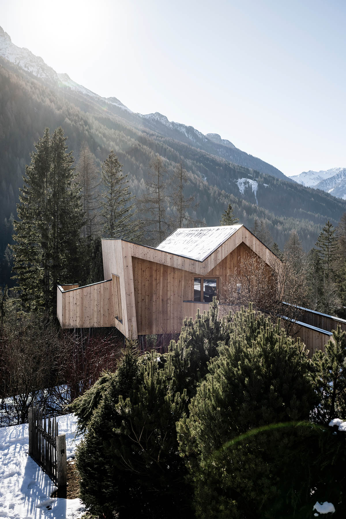Zigzag roof defines character of Olympic Spa Hotel by NOA in the Alpine meadow