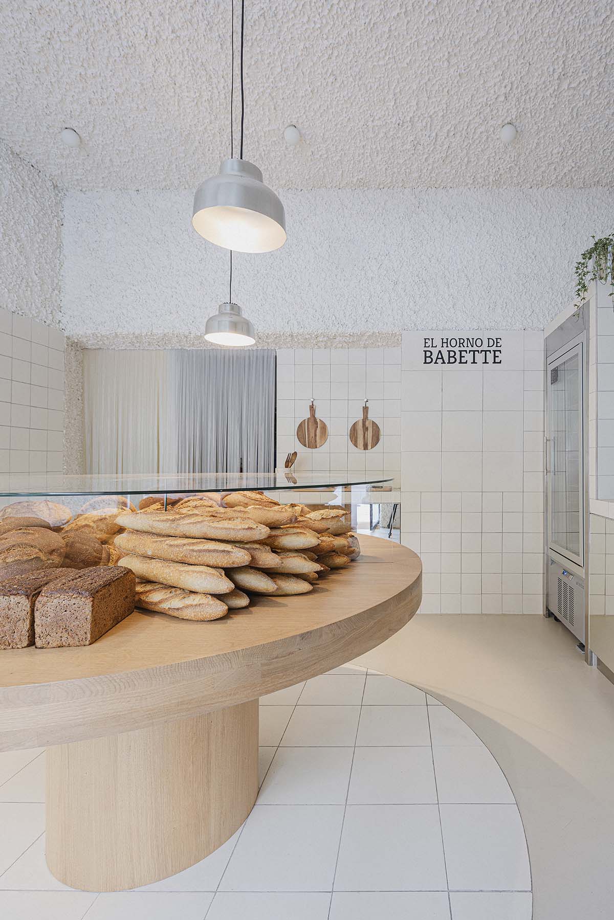 Bakery features central oak tables that revive the traditional dining room experience 