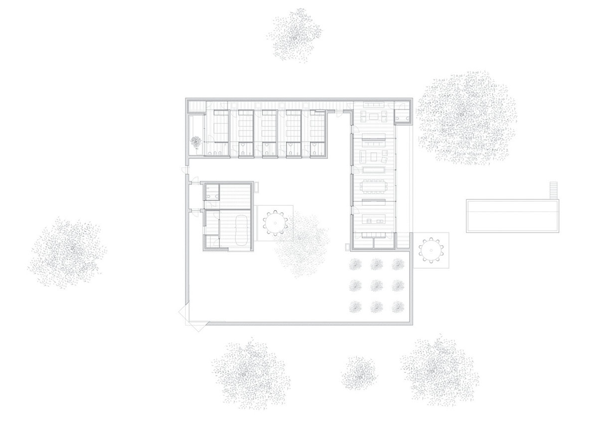 Low-profiled whitewashed stone walls wrap living units of Casa da Volta by PROMONTORIO and João Cravo