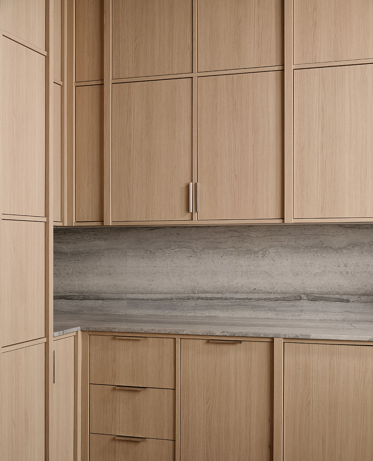 Eye care clinic features a sweeping glass block wall to disperse light in the interior