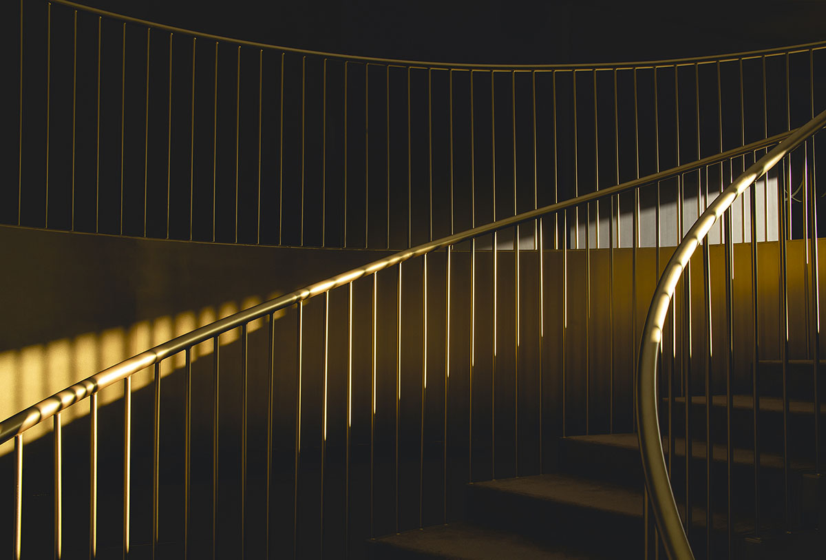 Pablo Muñoz Payá Arquitectos converts old industrial building into bridal store with golden interior