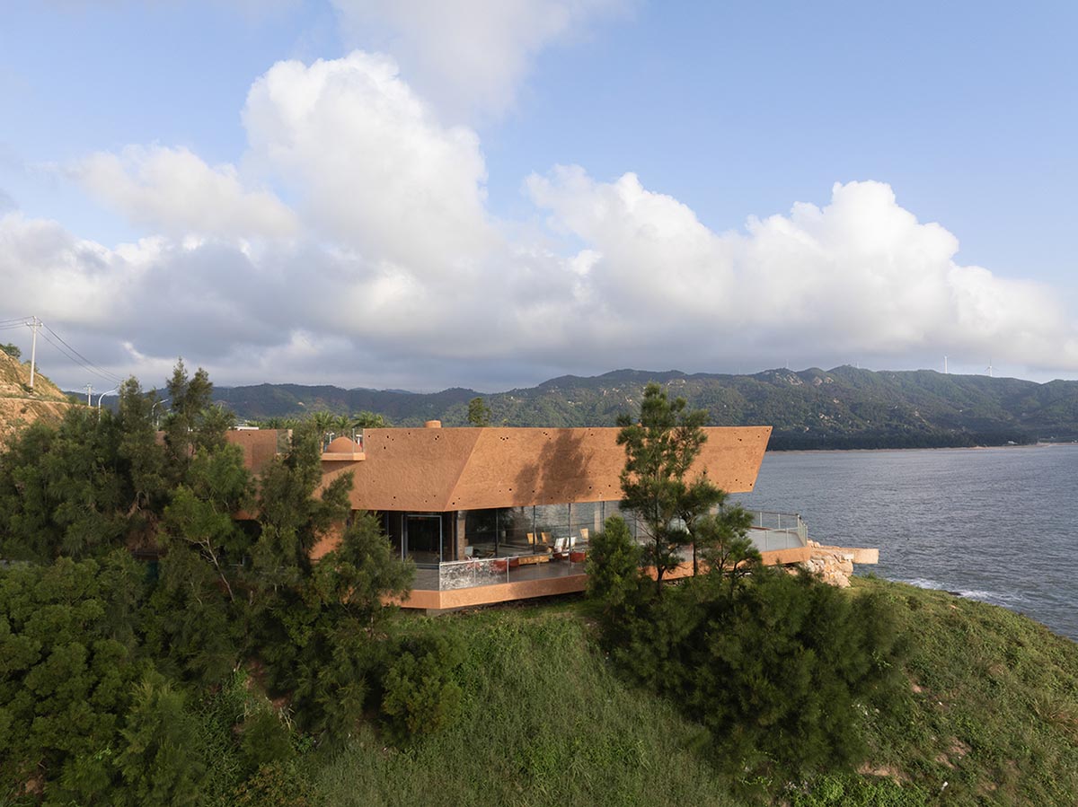 A gallery on a cliff features irregularly shaped lighting tubes that mimic marine creatures in China
