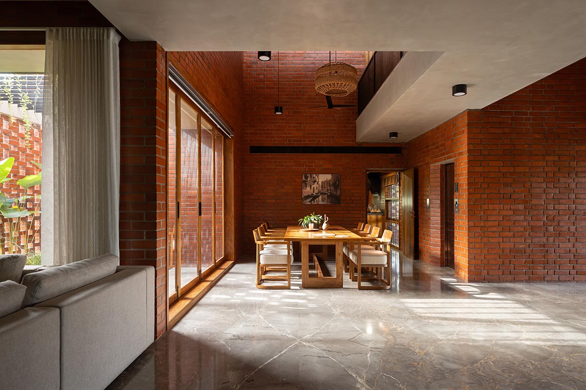 Srijit Srinivas - ARCHITECTS built brick family house with angled triangular façade in Kerala