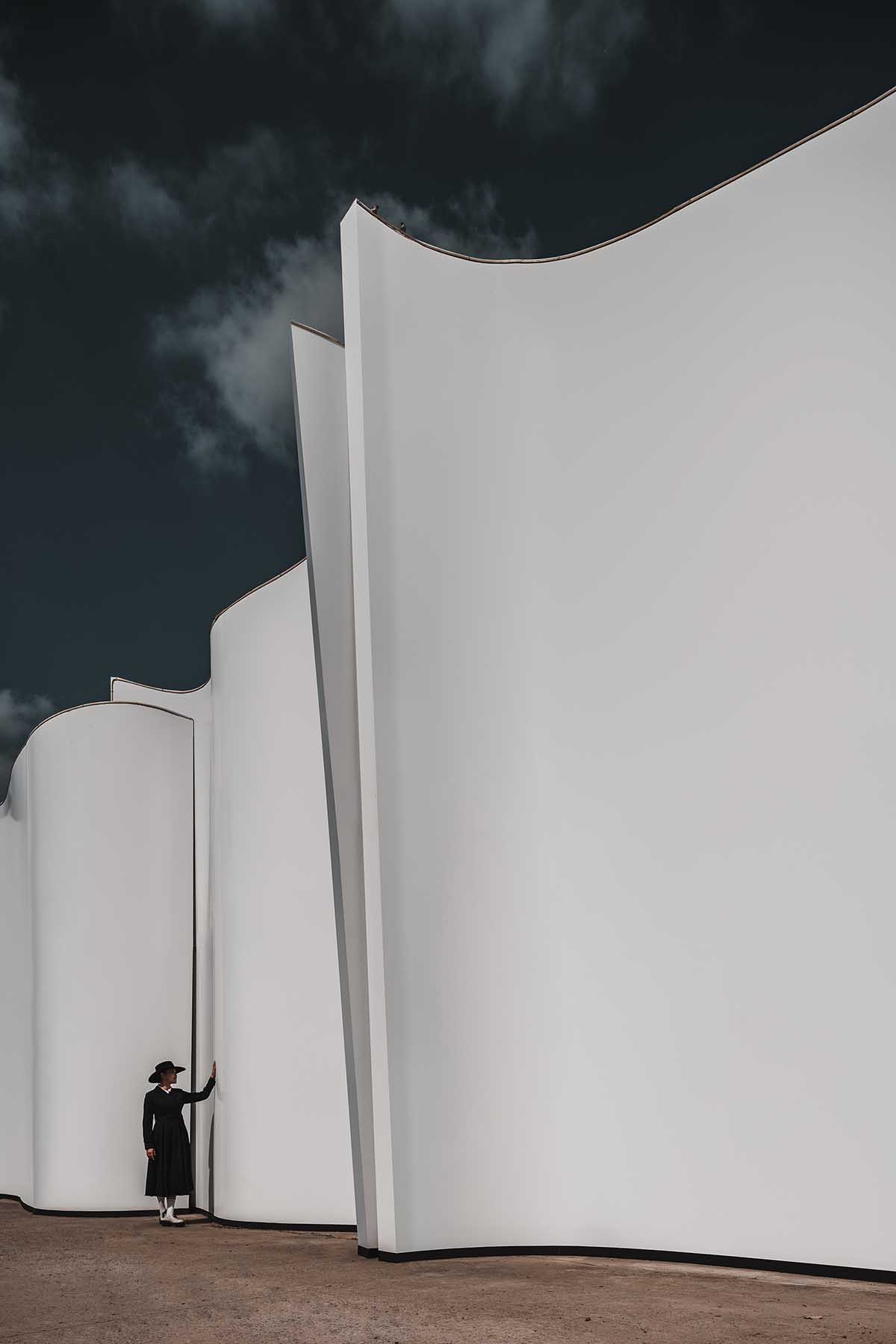 Chinese chapel creates a fluid silhouette featuring curving walls to mimic blossoming petals 