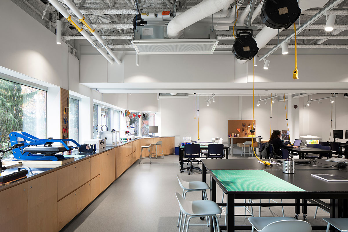 Whitish glass library designed by ACDF Architecture acts as a white floating volume in Quebec