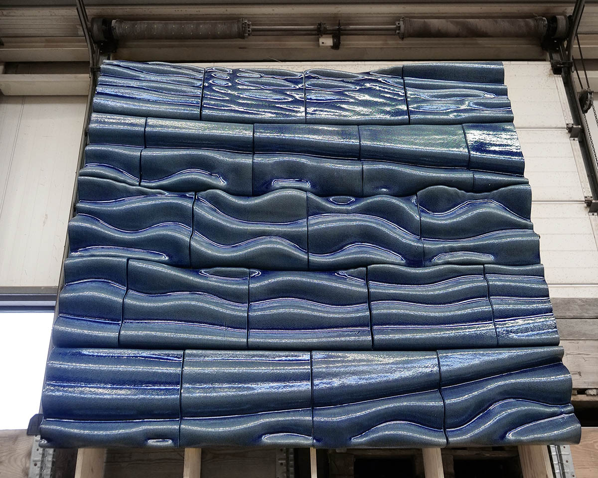 Studio RAP wraps the entrance of a hotel with majestic 3D printed ceramic walls 