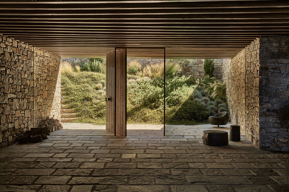 Terraced stonewalls sprawl down to offer an exploratory route in an old vineyard in Samos