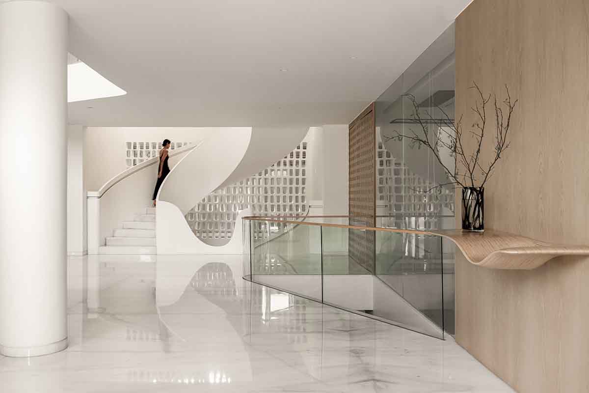 Sanjay Puri Architects uses fluid surfaces to create Nine X Nine House in India