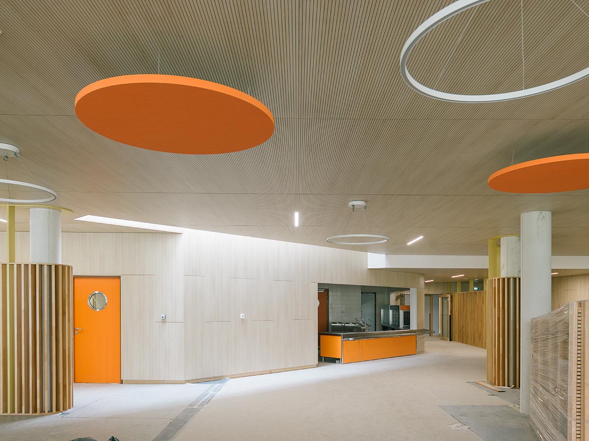 Wooden school by r2k architecte is inspired by Nordic architecture to be a positive energy building