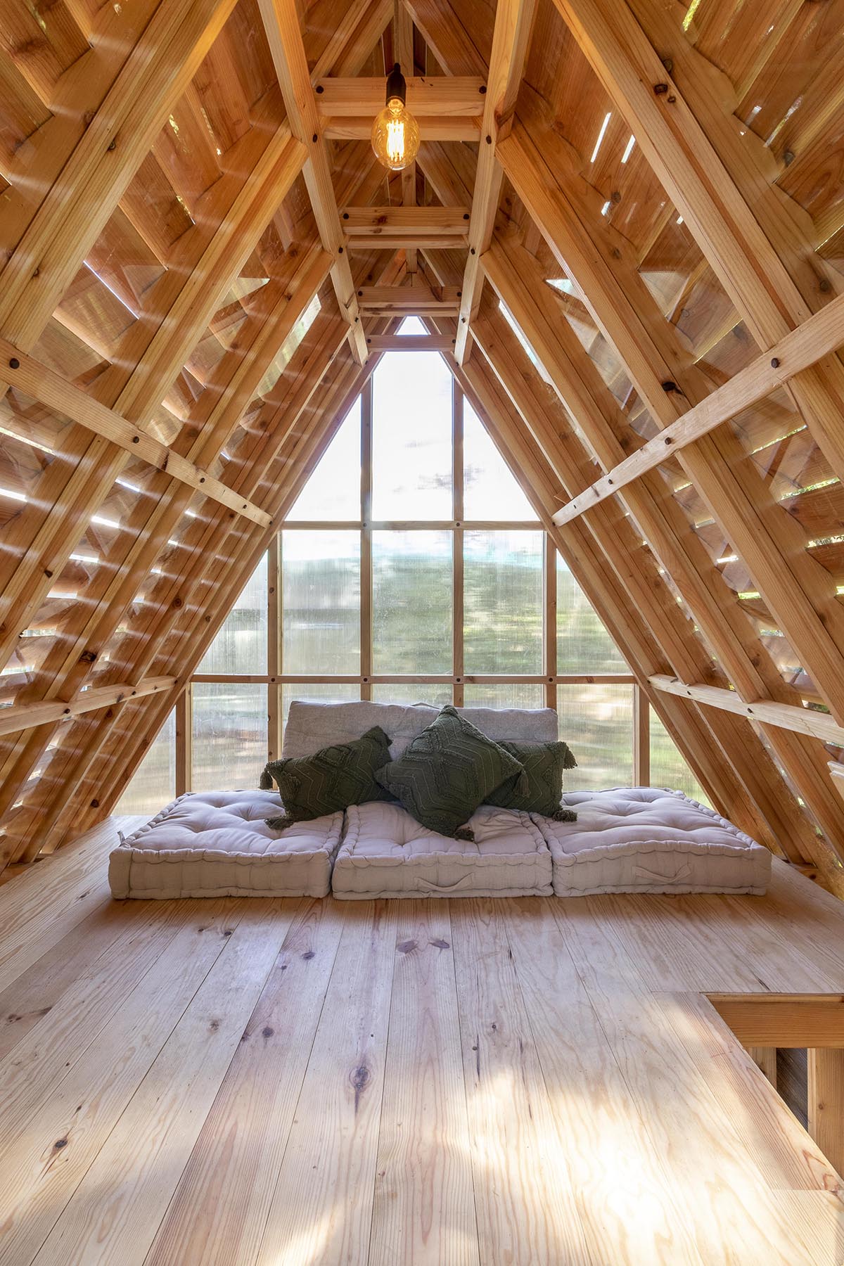 Wooden cabin by Madeiguincho is nestled among trees like an 