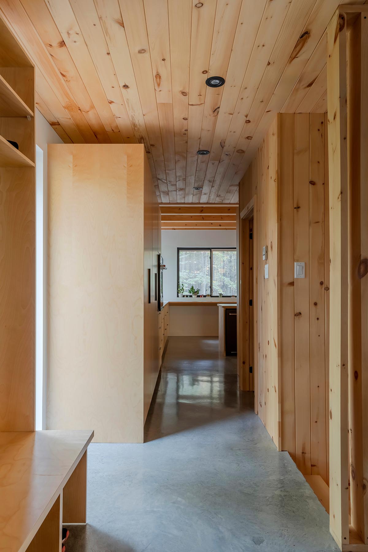 Country home is a wooden shelter that brings tranquility in the heart of the forest in Canada