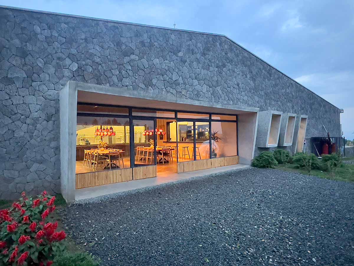 Striking geometric glass geometry resembles an open eye at a distillery in Rwanda