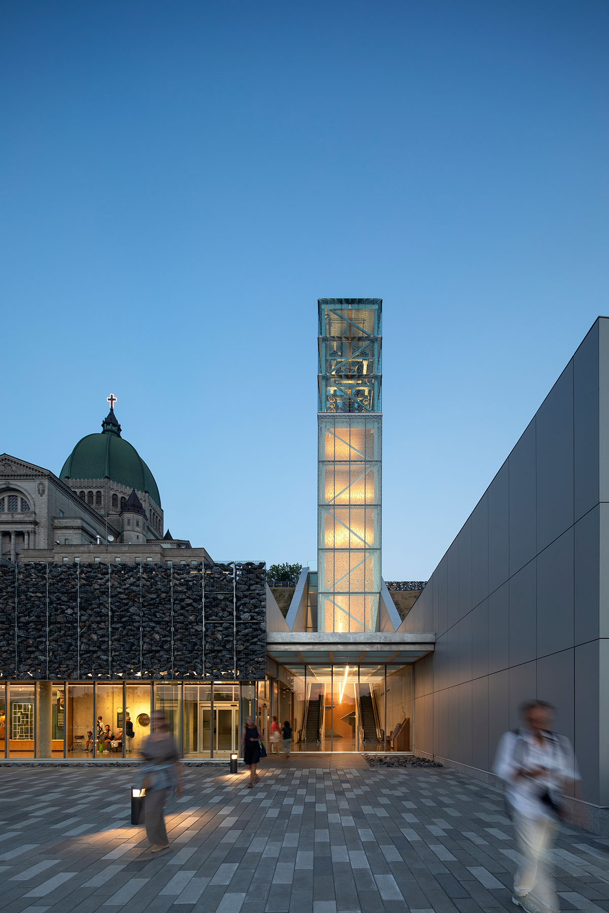 A striking bell tower pierces the sky, illuminating the grandeur of the pavilion in Montreal