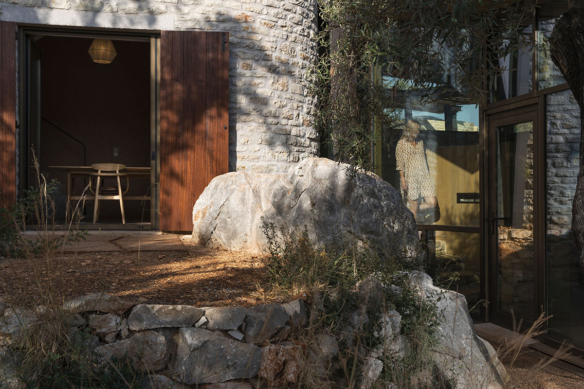 Pastoral round stone dwellings inform Meganisi House by Hiboux Architecture on Meganisi island