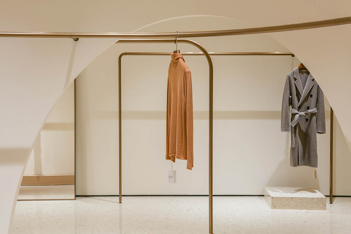 JYDP designs retail space with warm tones and curved walls in Shanghai