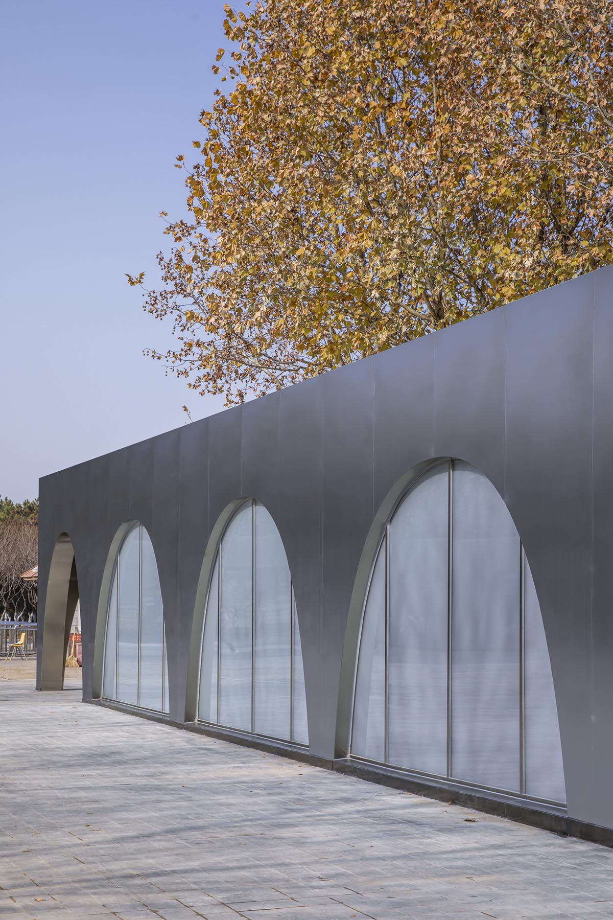 TEMP designs runner's station with stainless steel arcades in Beijing Olympic Forest Park