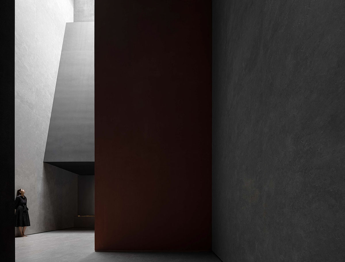 AD ARCHITECTURE creates dark interiors for showroom playing with light and sharp geometries in Foshan