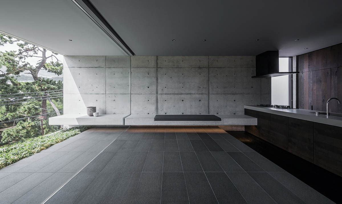 Gosize combines its office and residence on a natural stone base in Japan