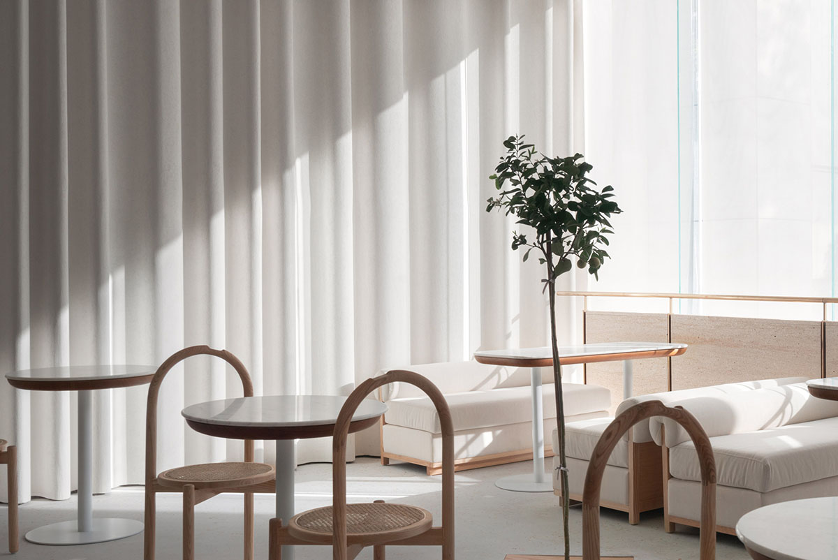 say architects uses curved tiled walls to merge exterior and interior for a patisserie in Hangzhou