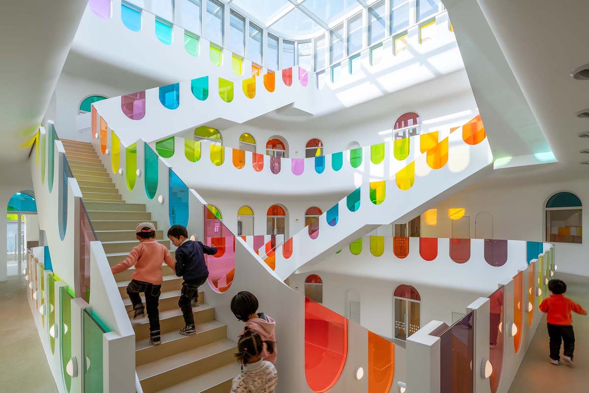 SAKO Architects designs colorful glass doors to evoke children's creativity in this school in China
