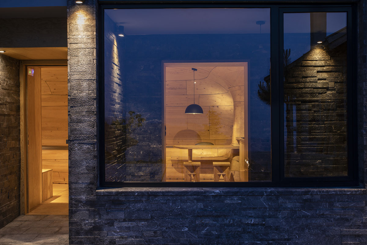 Tenon Architecture creates cave-like wooden interior for a resort in Greece