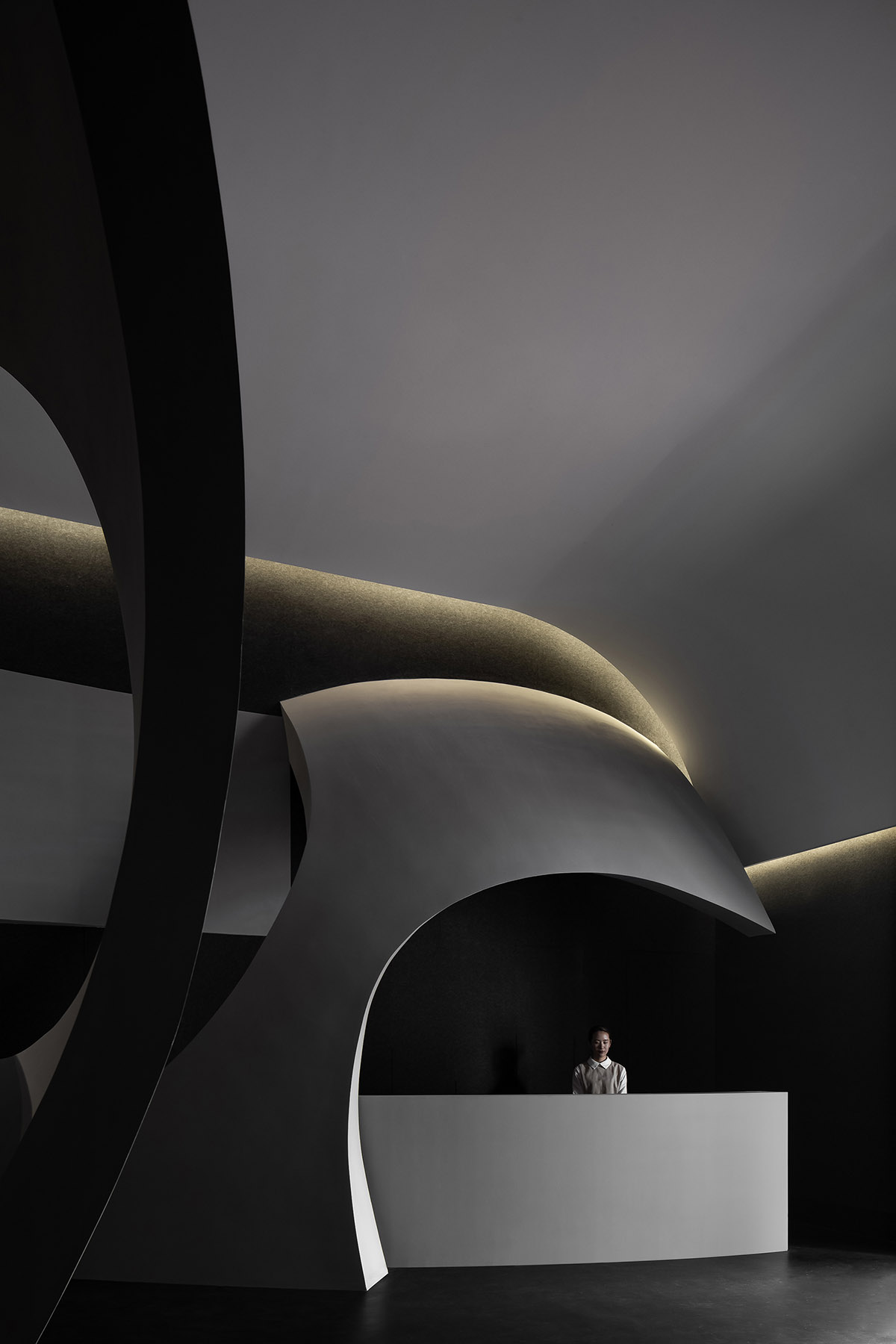 A beauty salon by AD ARCHITECTURE features dark-hued interiors drawing inspiration from cells