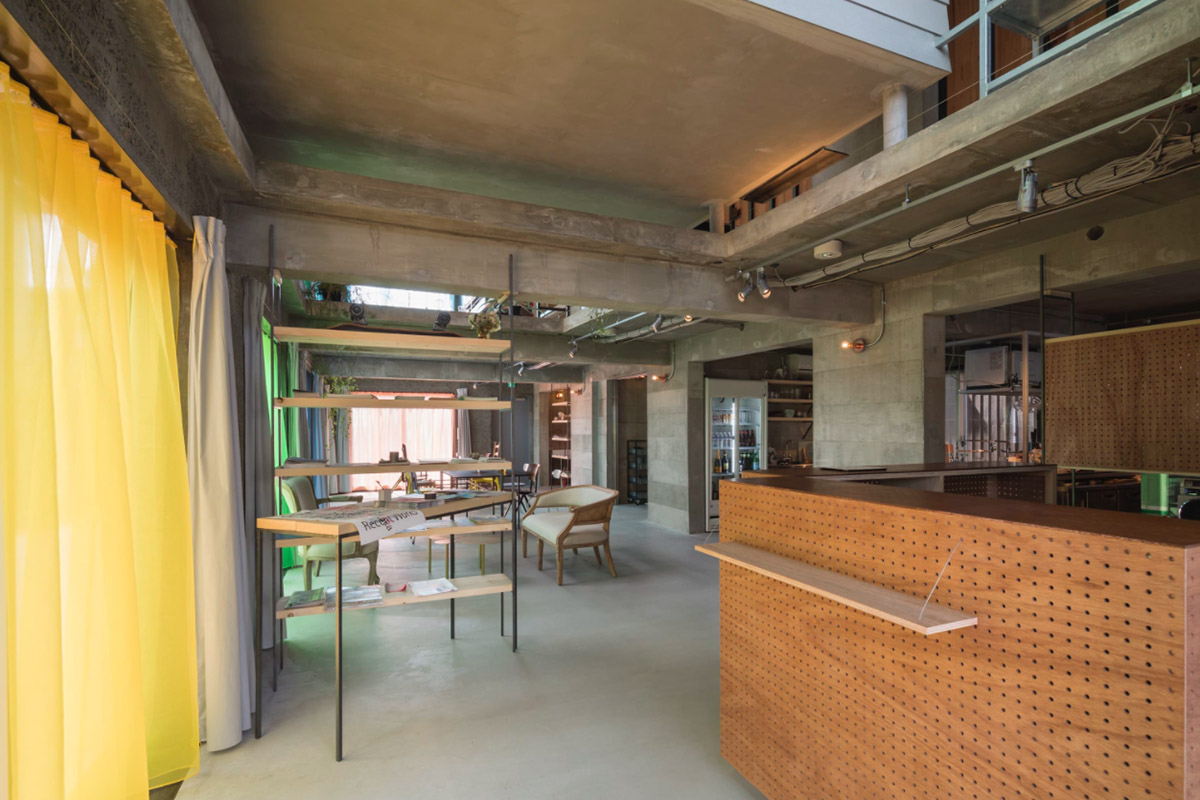 Tato Architects creates painted effect to this concrete hotel by using colourful curtains in Osaka