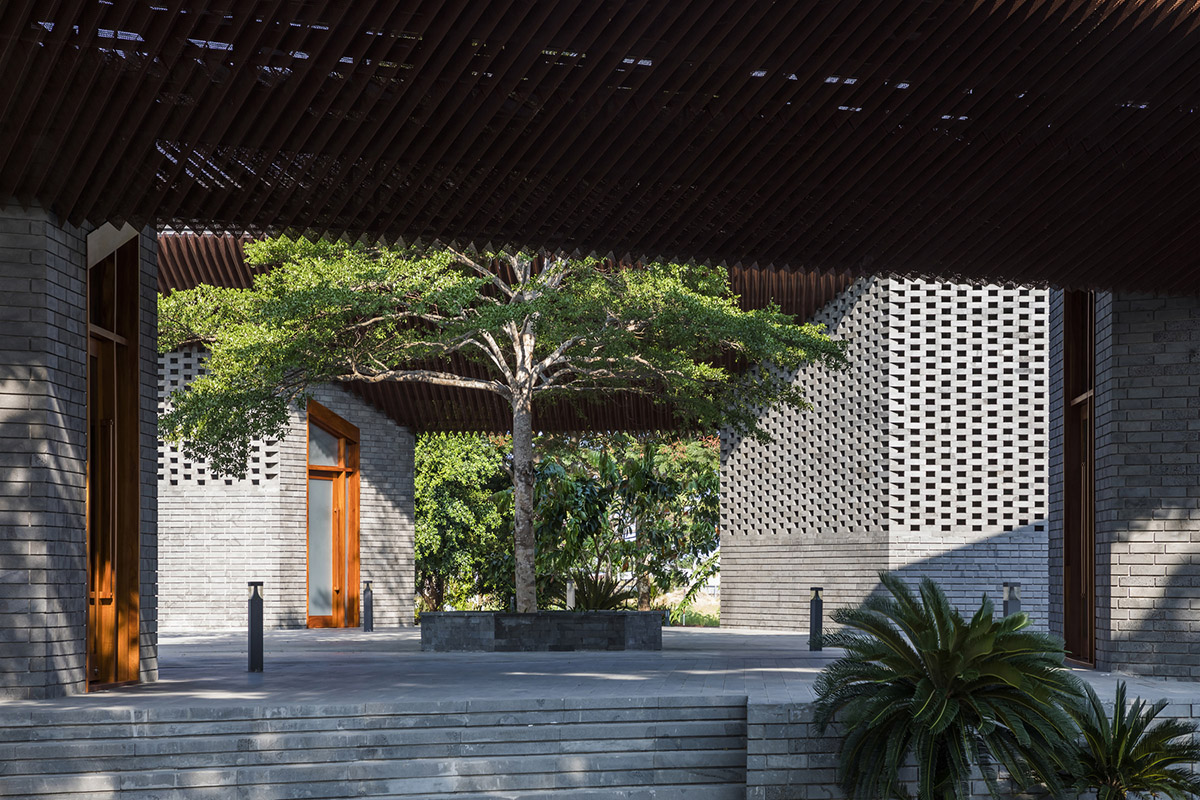 Hexagonal pavilions are hidden under V-shaped roofs that look like a pair of bird wings in Vietnam