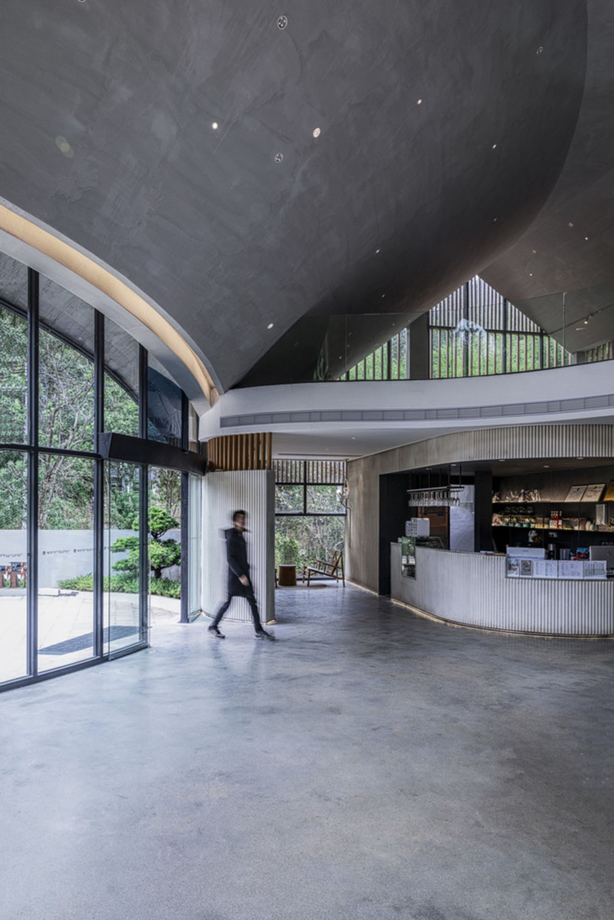 Wildurban Architects completes restaurant with cave-like roof in a forest in Huizhou, China