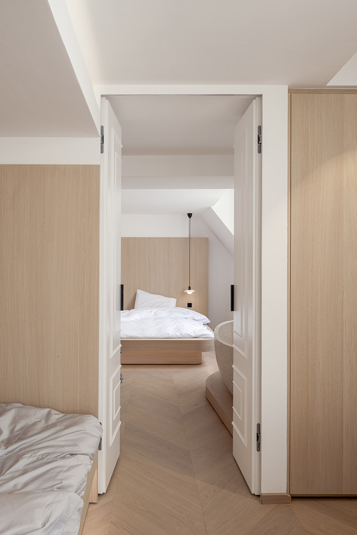 noa* converts 18th century hotel in Paris into an apartment with curved lines and scent of wood